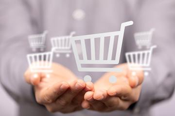 Businessman pressing modern technology panel shopping cart web phone credit card.