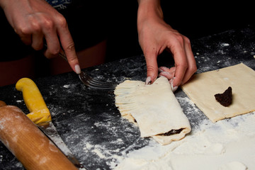 Baker prepares homemade cakes.