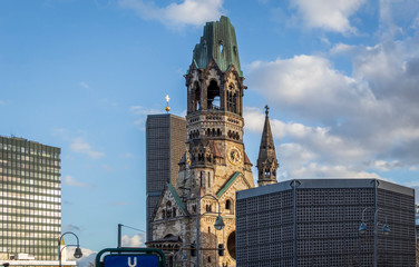 Fototapeta na wymiar Kaiser Wilhelm Memorial Church or Gedachtniskirche, one of iconic landmarks of Berlin, capital of Germany