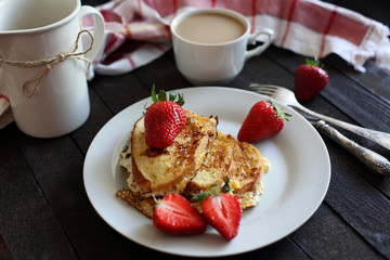 toast fried with egg with strawberries and coffee for Breakfast