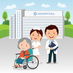 Medical staff and elderly woman in wheelchair 