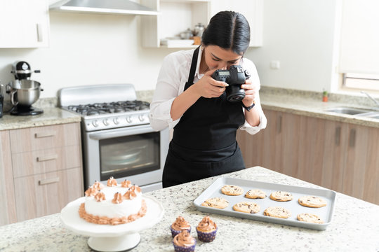 Blogger Photographing Sweets In Kitchen