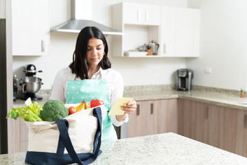 Good Looking Woman With Fresh Vegetables In Kitchen