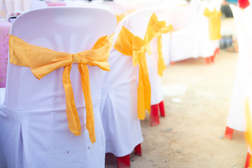 Wedding chair decoration with gold ribbon