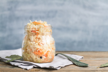 Homemade russian sauerkraut in a glass jar with copy space