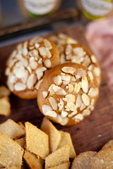Almond Chip Cookies. Almonds on a round homemade cookie. Still life, food closeup on a wooden table. Appetizing pastries.