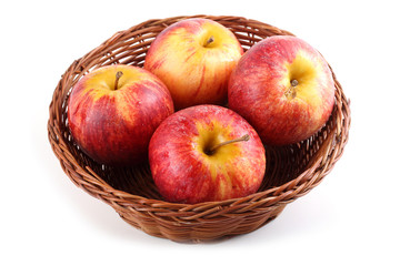 Gala apples on wicker plate