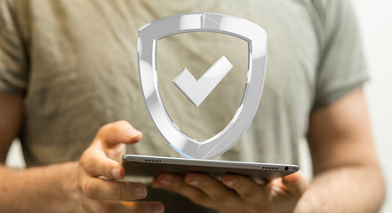 shield protection concept holding in hand