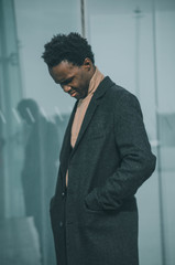 portrait of a elegant man near to a building