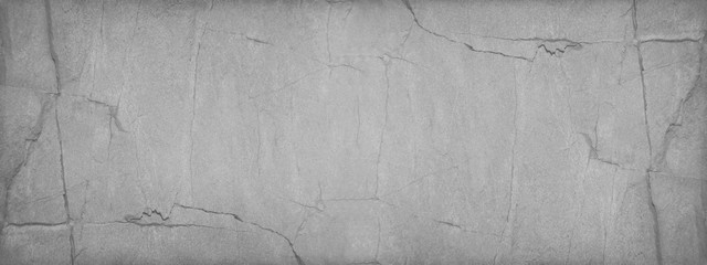 Grunge gray background with copy space. Grunge banner with cracked stone texture.