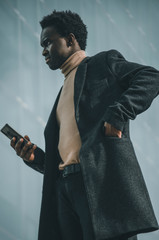 Black businessman with a smartphone