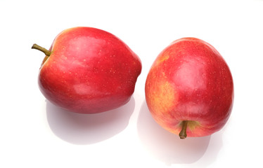 two red apples on a white background