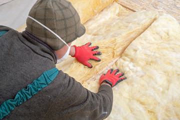 Work composed of mineral wool insulation in the floor, floor heating insulation , warm house,...