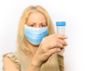 Nurse woman with face mask holding a test tube for laboratory testing or experiments. Concept of scientific research, virus test. Isolated on white background.