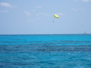 Surfer between Isla Mujeres and Cancun city in Mexico
