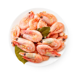 Cooked prawns in a plate on a white background. The view from top.
