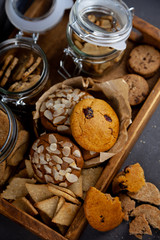 A set of different homemade cookies. Cookies close-up. Background from delicious pastries. Cookie with coconut, mishdal, chocolates, raisins, lingonberries. Round, rhombuses, bears, flowers shapes.