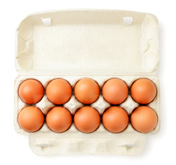 Open container with chicken eggs on a white. The view from the top.