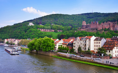 Fototapeta na wymiar Embankment of Neckar river and ship in Heidelberg in Germany