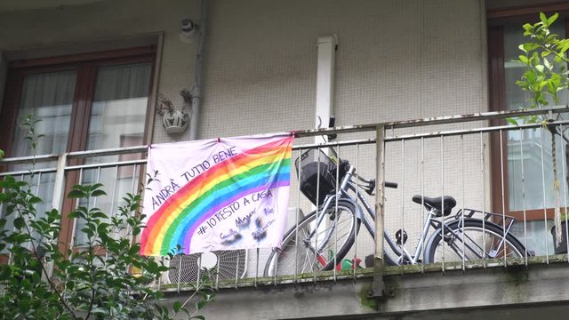 Europe, Italy, Milan March 2020, Coronavirus emergency - On the windows of the city hang sheets designed by children with rainbow and the words "everything will be fine" ( Tutto Andra' bene ) -