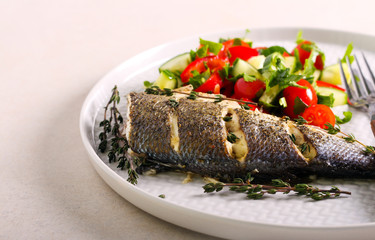 Baked thyme fish and salad