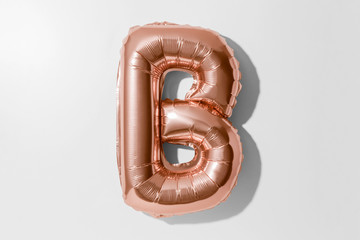 Letter B, Rose gold foil balloon alphabet isolated on white background with Clipping Path