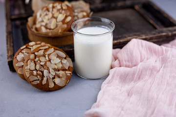 Sweet almond cookies  on wooden table.French homemade cookie. Useful Lenten cookies from almond flour with honey on rustic wooden background. Selective soft focus.