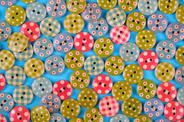 bright background made of multi- colored buttons. the view from the top