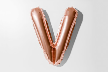 Obraz premium Letter V, Rose gold foil balloon alphabet isolated on white background with Clipping Path