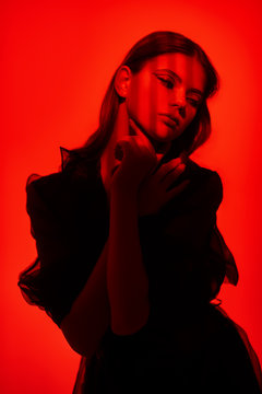 Portrait Of Girl In Red Light