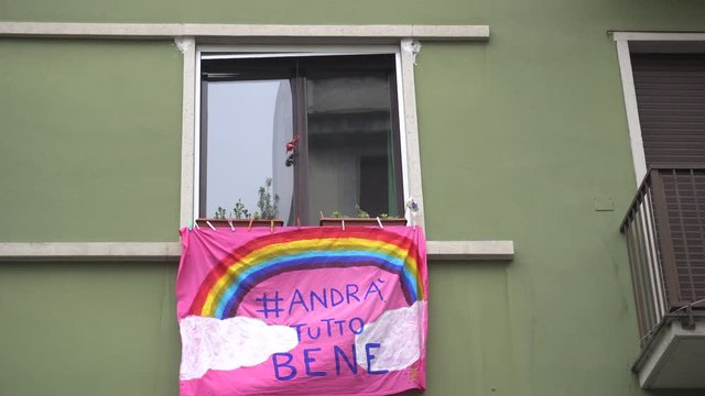 Europe, Italy, Milan March 2020, Coronavirus emergency - On the windows of the city hang sheets designed by children with rainbow and the words "everything will be fine" ( Tutto Andra' bene )