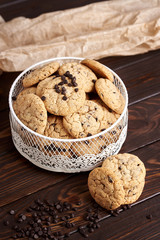  Dietary cookies with dark chocolate on a wooden background.