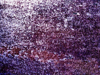Canvas texture purple background. Small splashes of paint purple, blue, cyan. A fine texture of peeling paint.