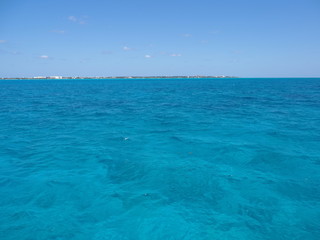 Clear water between Isla Mujeres and Cancun city in Mexico
