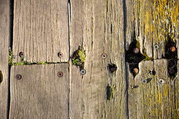 Close-up of brown weathered boardwalk planks background.