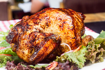 Roasted chicken and salad close view