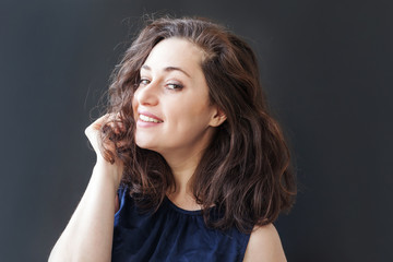 Happy girl smiling. Beauty portrait young happy positive laughing brunette woman on black background isolated. European woman. Positive human emotion facial expression body language