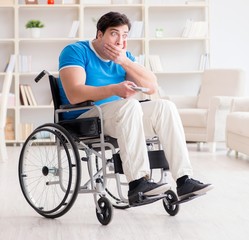 Obraz premium Disabled man watching sports on tv