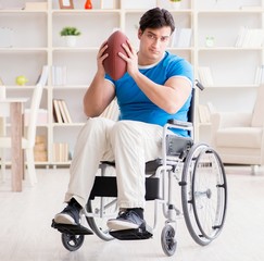 Obraz na płótnie Canvas Young man american football player recovering on wheelchair