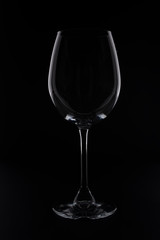 empity red wine glass on black background