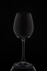 empity red wine glass on black background