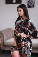 Attractive young model demonstrating clothes. Spring colections on elegant brunette woman