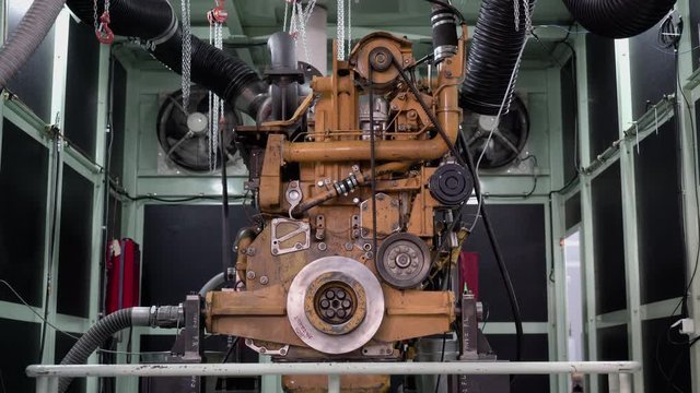 An old engine in a special chamber is waiting for a test run.