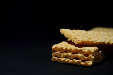 Grain crispbreads isolated on black background