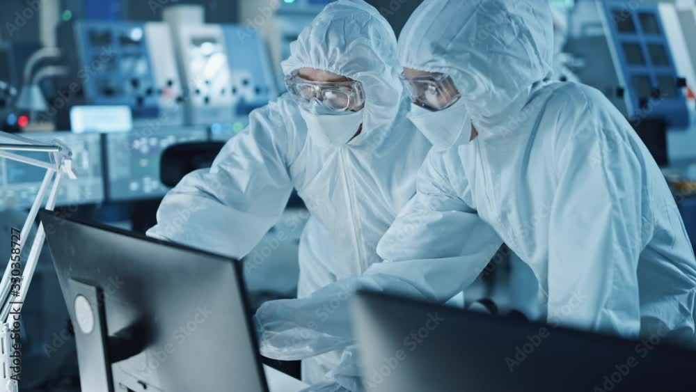 Poster research factory cleanroom: engineer and scientist wearing coveralls talk and work on computer, use 