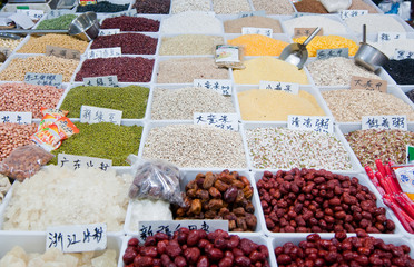 Small grocery shop with seeds at food market on Old City of Shanghai, China