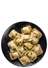 Meat dumplings - russian pelmeni, ravioli with meat in black plate isolated on white background. with copy space. top view