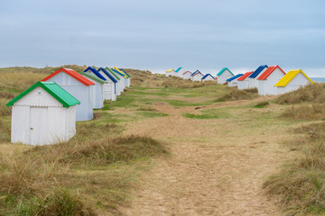 Gouville, France - 12 31 2018: Colorful bathing cabins of Gouville