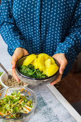 Vegan, vegetarian lunch or dinner. Potato and spinach. Salad cabbage, sunflower seeds