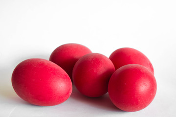 five red easter eggs on white background